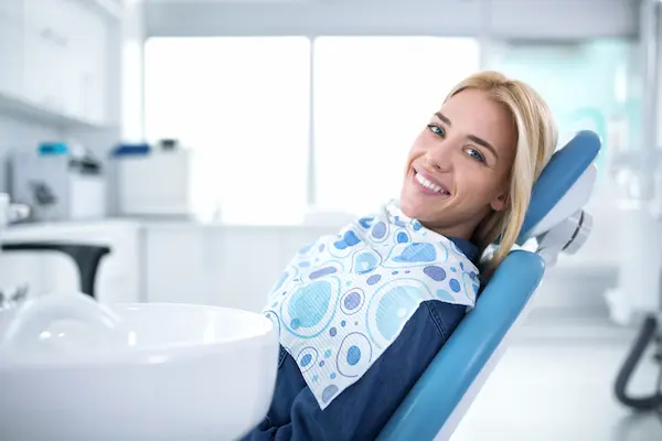 satisfied patient in a dental clinic after treatment